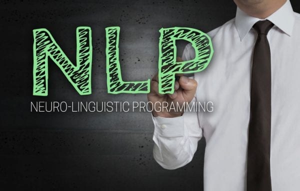 NLP is written by businessman on screen