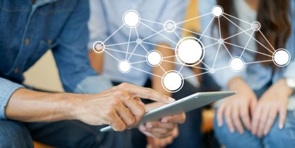 close up businessman manager point on tablet and meeting with secretary woman with futuristic network connecting line communication for future technology concept