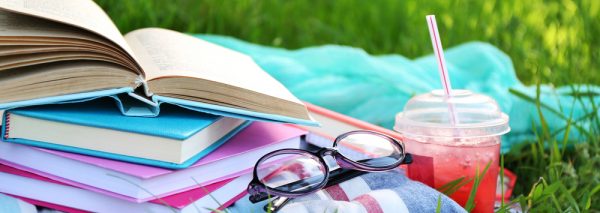 Books,,Glasses,And,Drink,On,Grass,Close-up